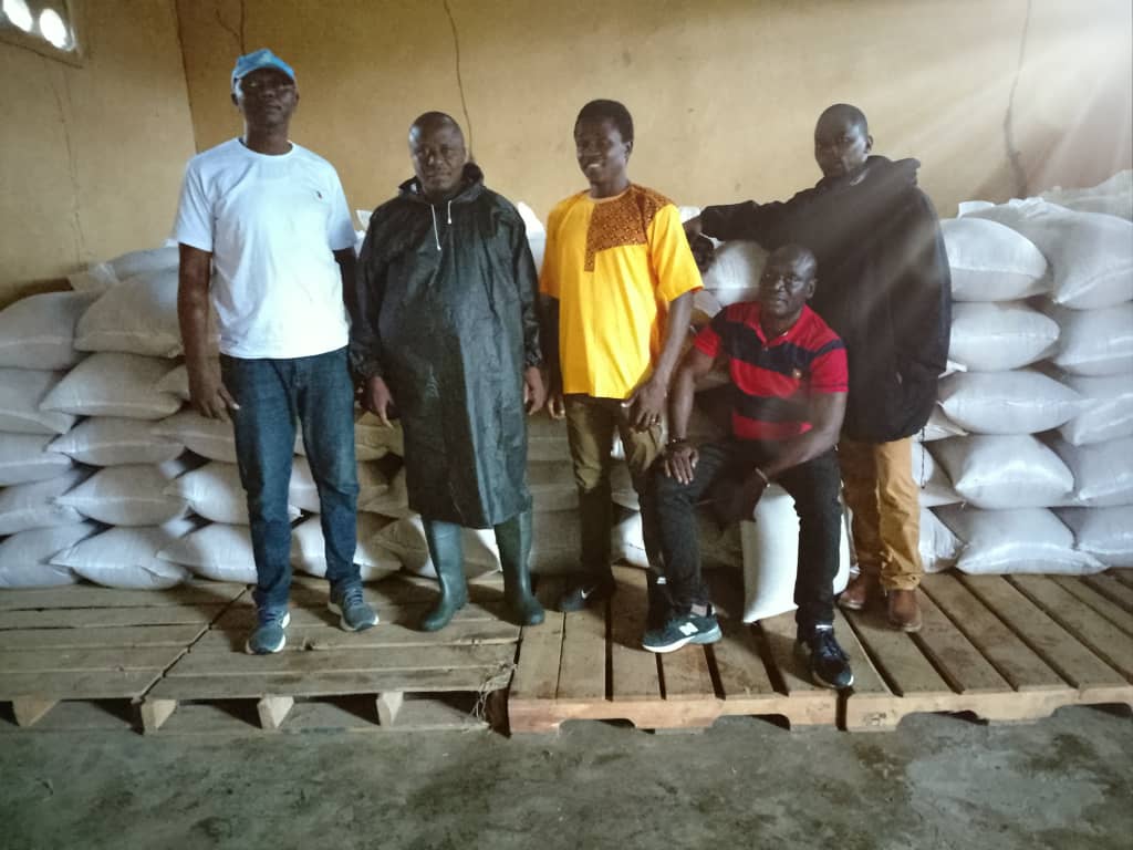Kondibu team members in warehouse with agricultural products